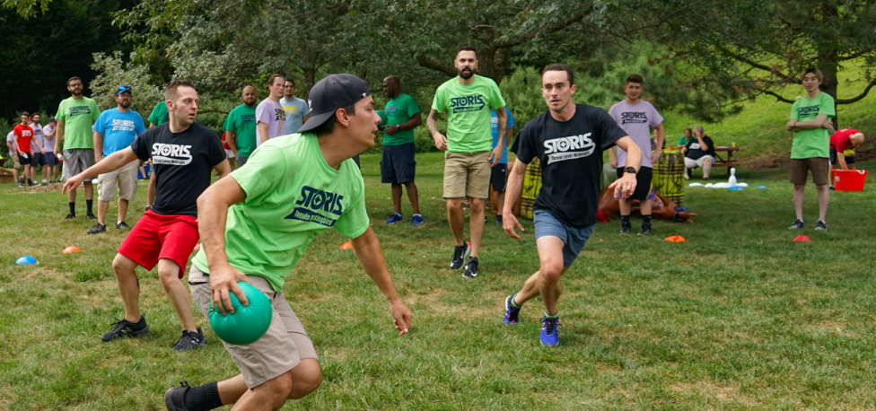 The STORIS Team Playing a Game at Its Annual Summer Olympics