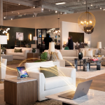 Unified commerce software connecting a tablet and laptop across a home furnishings showroom